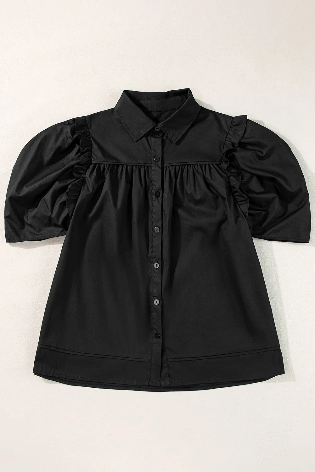 Chemise ample noire à manches bouffantes